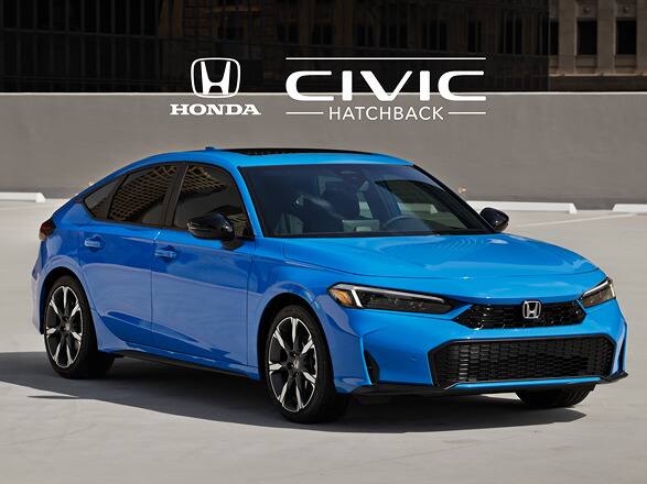 2027 Honda Civic Hatchback Sport Touring Hybrid in Boost Blue Pearl profile on a rooftop parking lot with city buildings (Compact Hatchback).